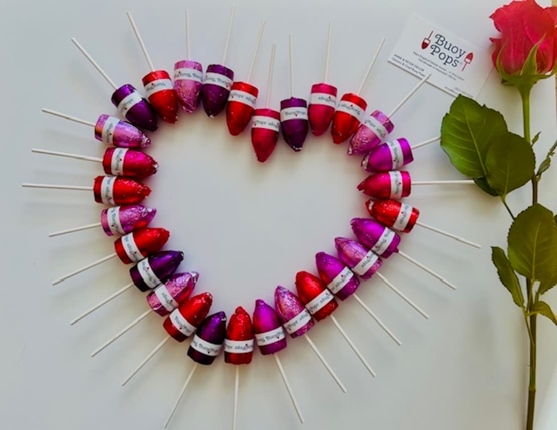 Buoy Pops chocolates arranged in a heart for gifting